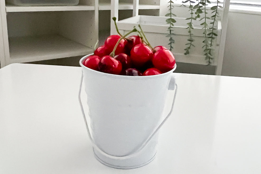 A bucket of cherries in a classroom