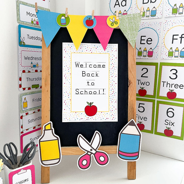 Brightly coloured classroom printables are in a classroom setting with school supply themed cut outs on a blackboard. There is a sign that says Welcome Back to School
