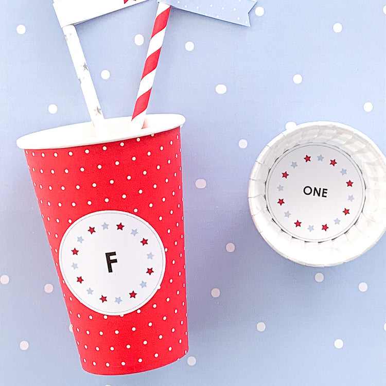 Cut out circles used as party decorations on cups in a carnival theme
