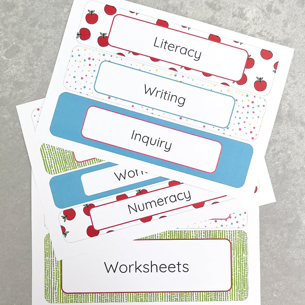 Teacher classroom labels with colourful borders on a grey surface