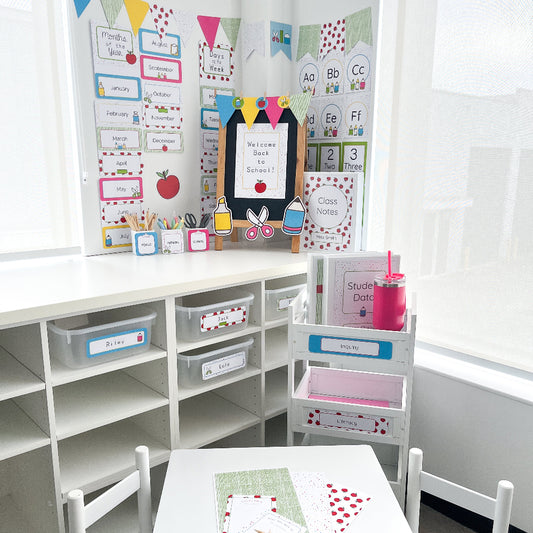Bright, colourful, educational classroom setup with blackboard, shelves, and children's chairs.