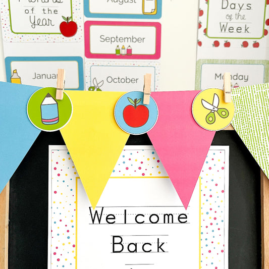 Educational classroom decorations with colorful pennants and text on a blackboard.