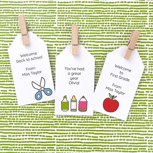 Three personalised cards with teacher messages on a green patterned background