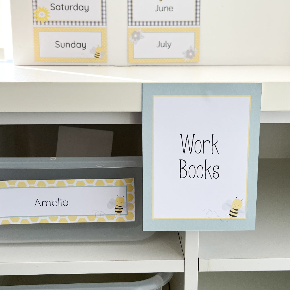 Storage labels for a shelf with 'Work Books' and 'Amelia' labels.