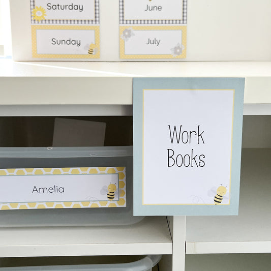 Storage labels for a shelf with 'Work Books' and 'Amelia' labels.