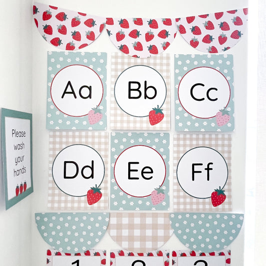 Educational alphabet cards with strawberry theme on a white background