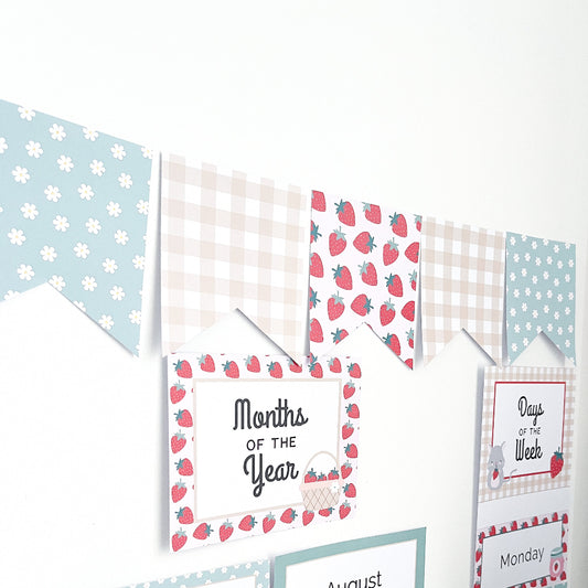 Set of educational posters with strawberry patterns on a white background. There is a bunting garland above them.
