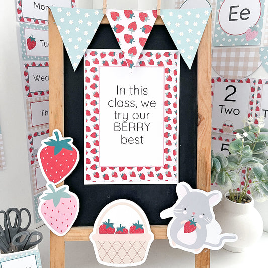 Educational classroom decor with strawberry-themed signs and bunting.