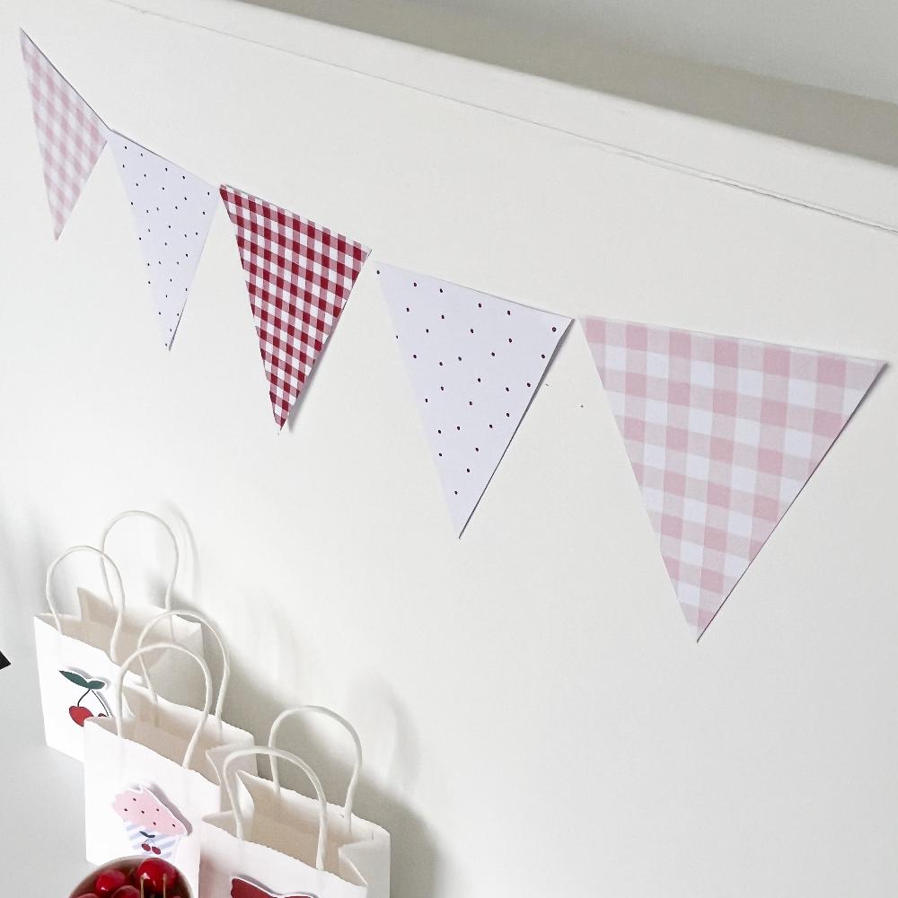 Red and Pink Bunting Flags on white wall