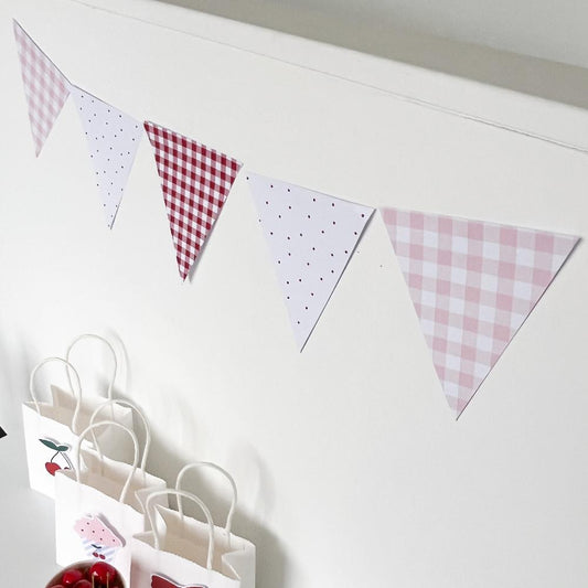 Red and Pink Bunting Flags on white wall