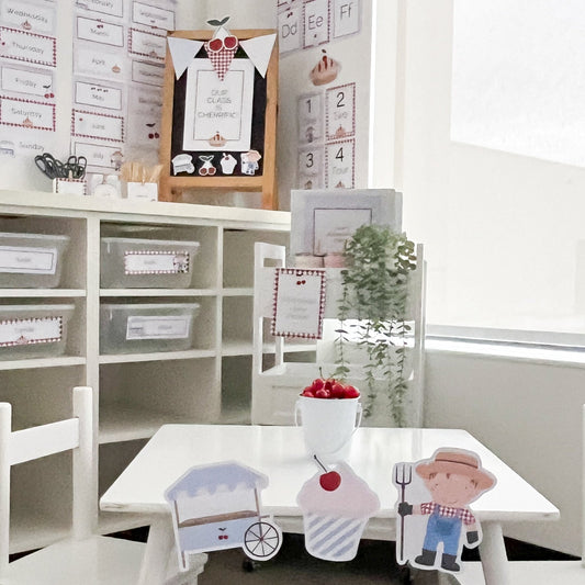 Classroom set up with cherry themed decor including farmer, market stand and cupcake.