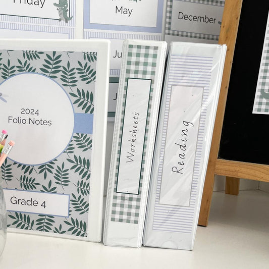 Teacher Binders decorated in a pale blue and green theme.