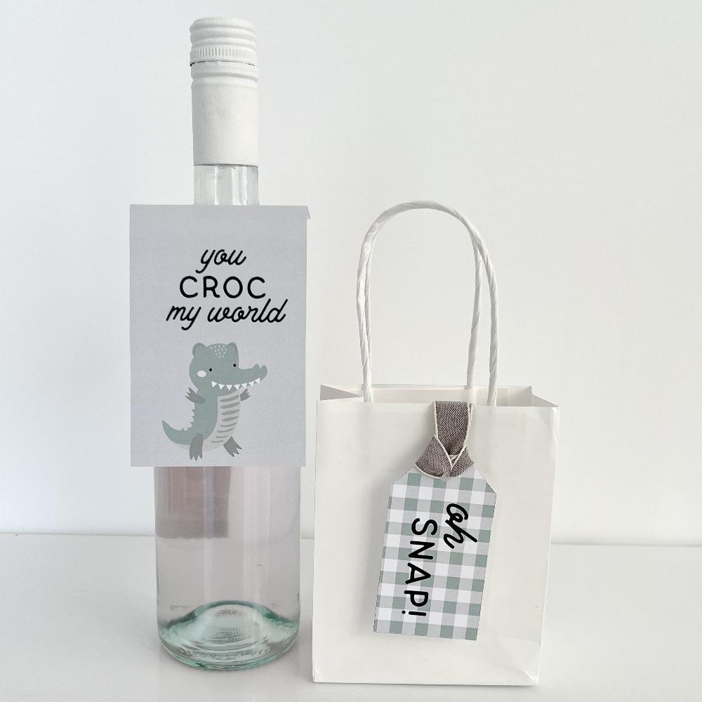 Crocodile themed wine label and bag swing tag on white background