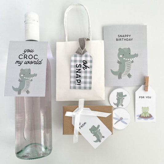 Crocodile or alligator themed gift decor on a white background