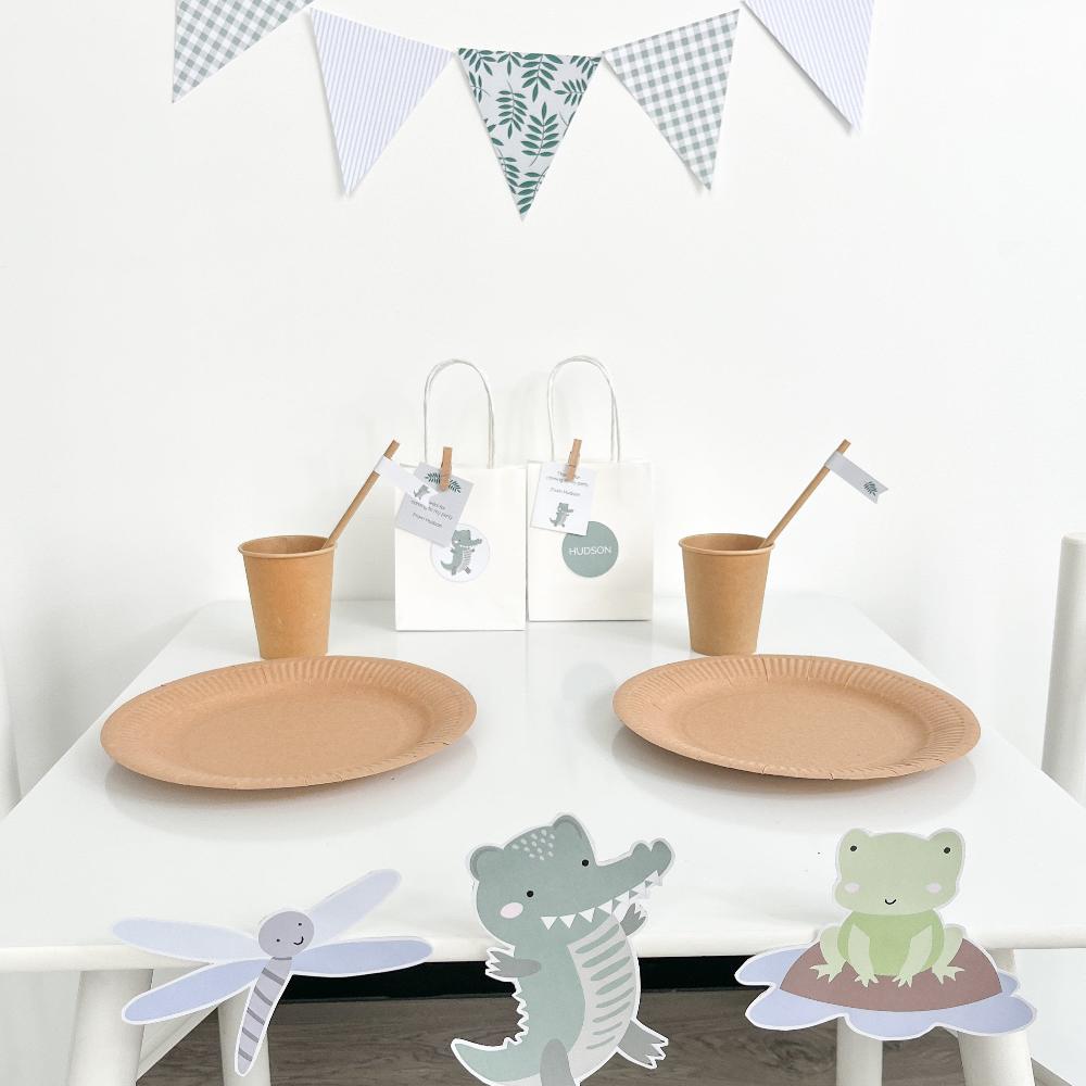 Crocodile or alligator themed party table set up with cute graphics