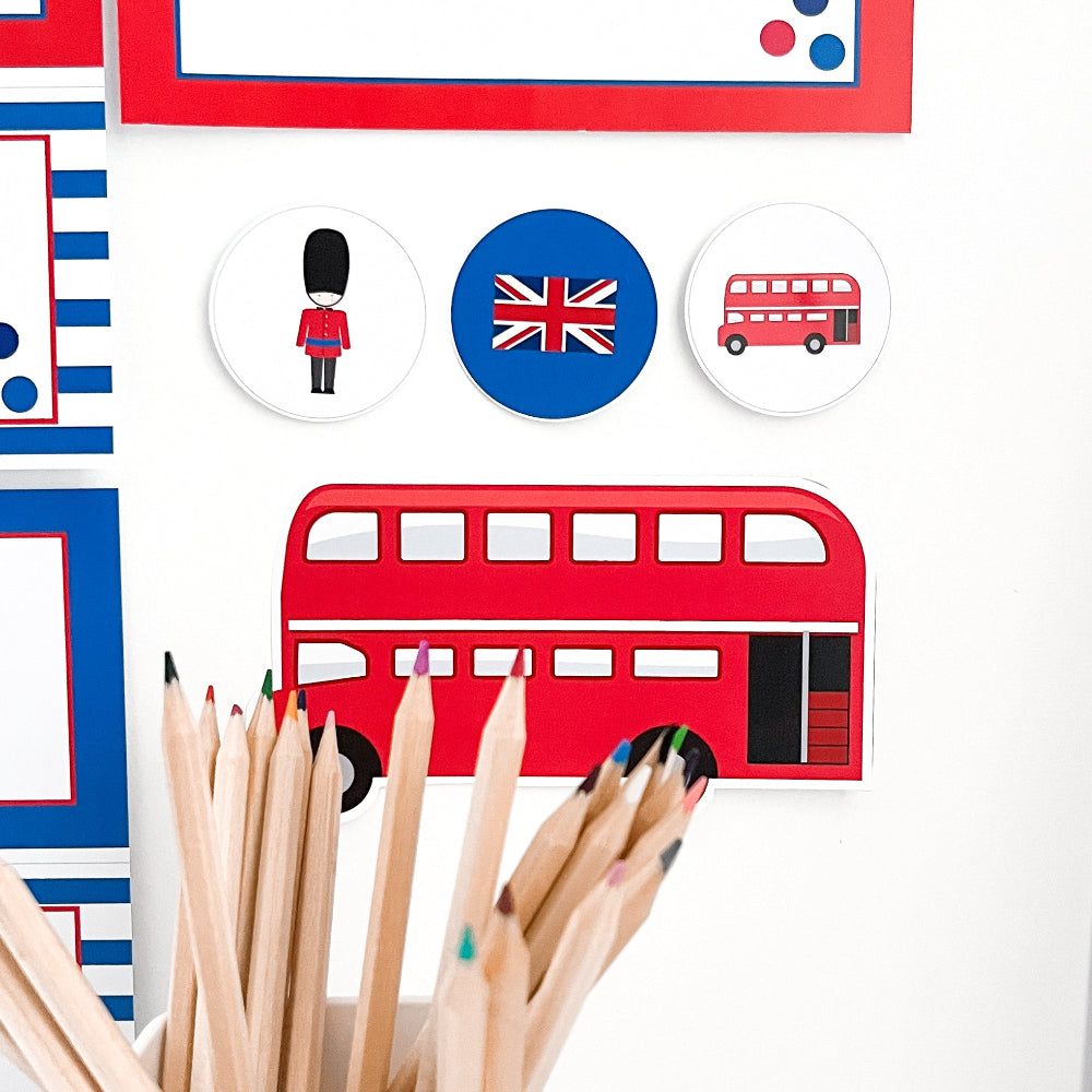Classroom accents with British-themed elements including a red double-decker bus, Union Jack, and guard figure on a white background.