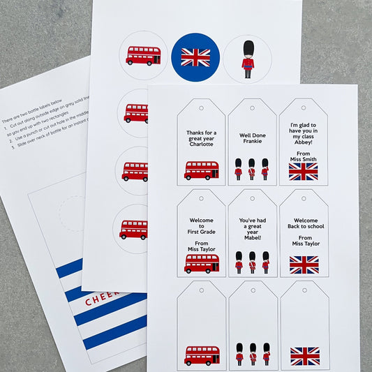 Sheet of personalised tags with British-themed designs on a grey surface