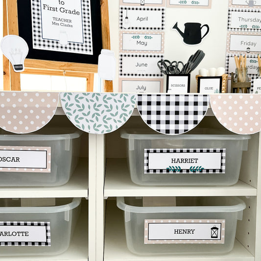Farmhouse themed classroom decor pieces decorate a classroom cabinet and bench. There is a scallop shape border running across the top.