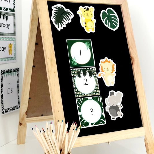 Wooden easel with blackboard, bulletin board accents, and pencils on a white background