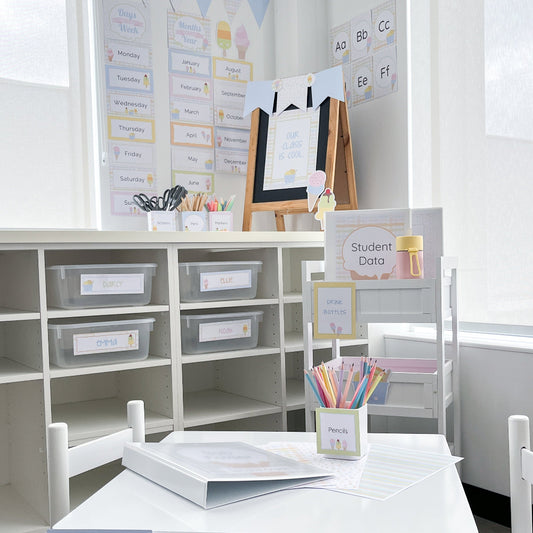 Educational classroom setup with tables, chairs, and storage shelves.