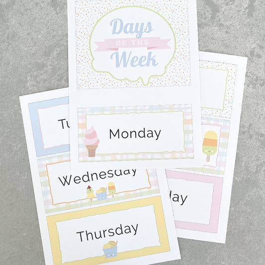 Set of pastel coloured educational cards with days of the week on a grey background
