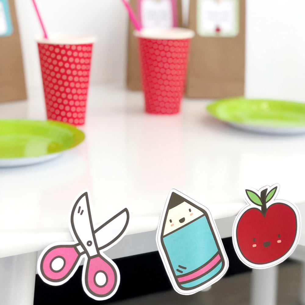 Back To School Party Decor Bundle - Cut Outs on white table with party set up in background