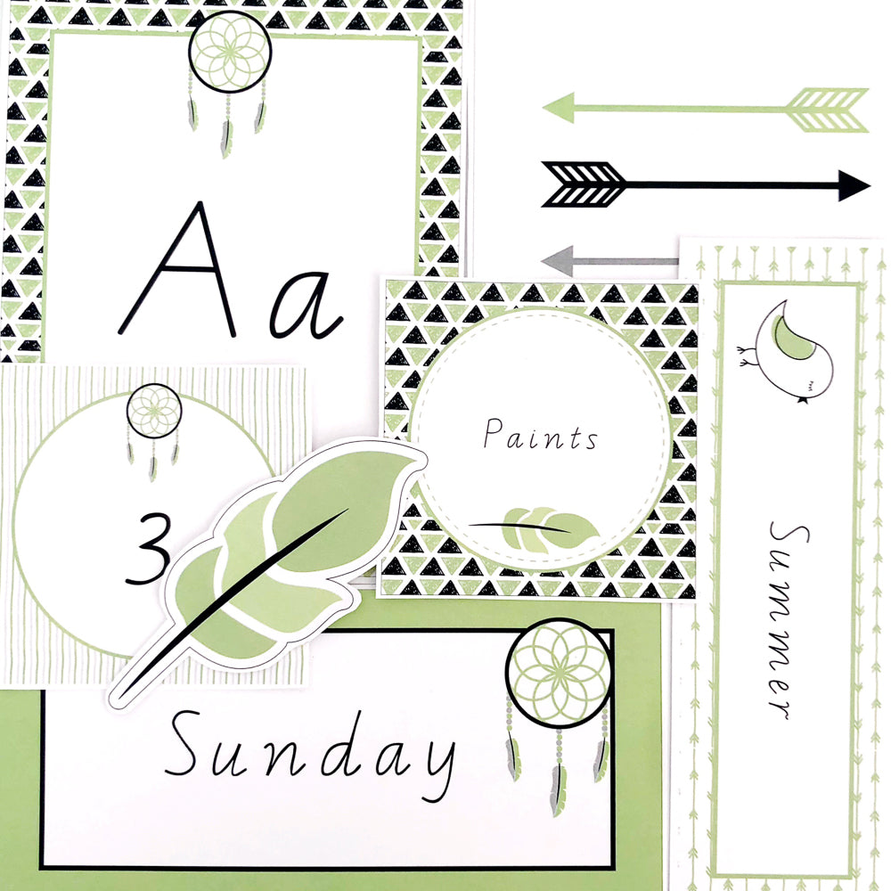 Green, black and white educational resources flat layed on white background