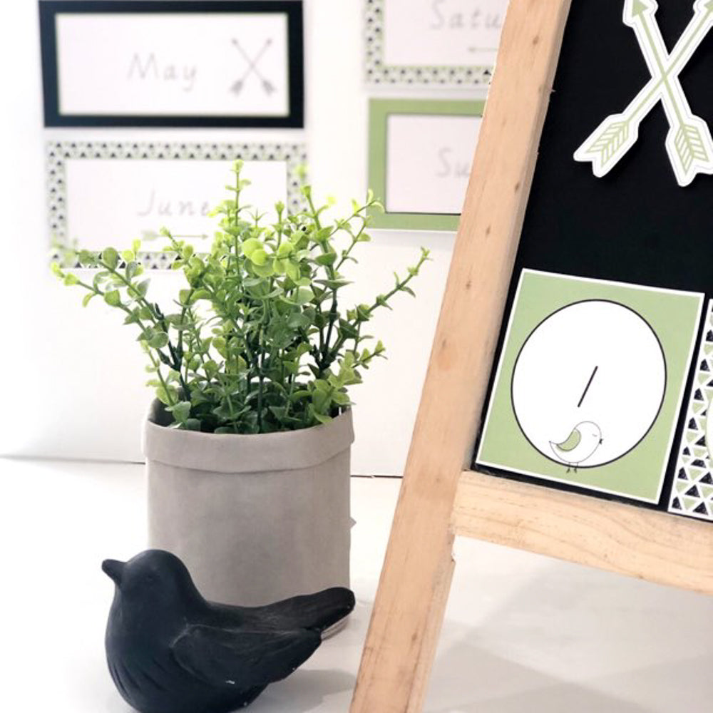 Bird and plant decor surrounded by educational printables in green, white and black.