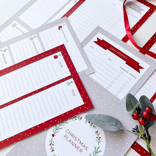 Printable Christmas planner with a red and white design, including cover page and various lists such as 'To Do' and 'Baking List'.