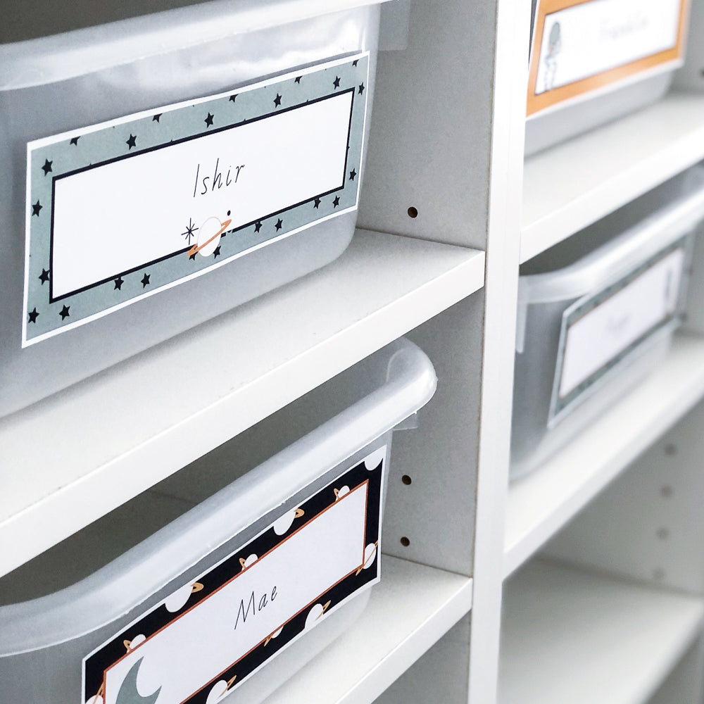 Editable classroom themed printable files displayed on a shelf, with various labeled storage boxes.