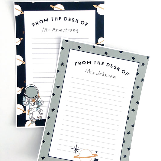 Space themed note paper on white background