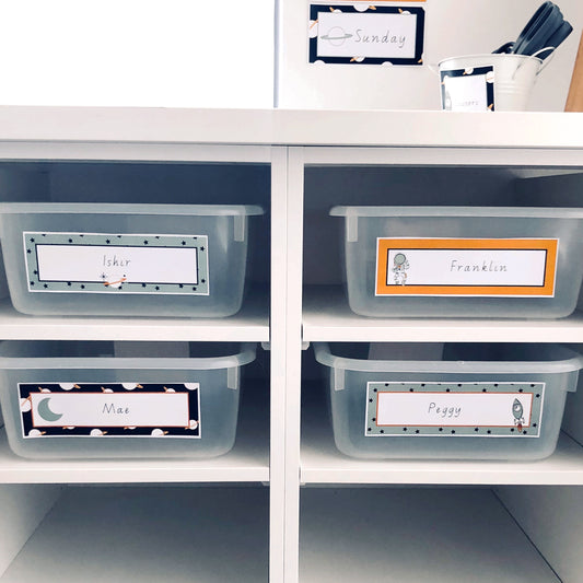 Close up of space themed name labels on classroom locker tubs