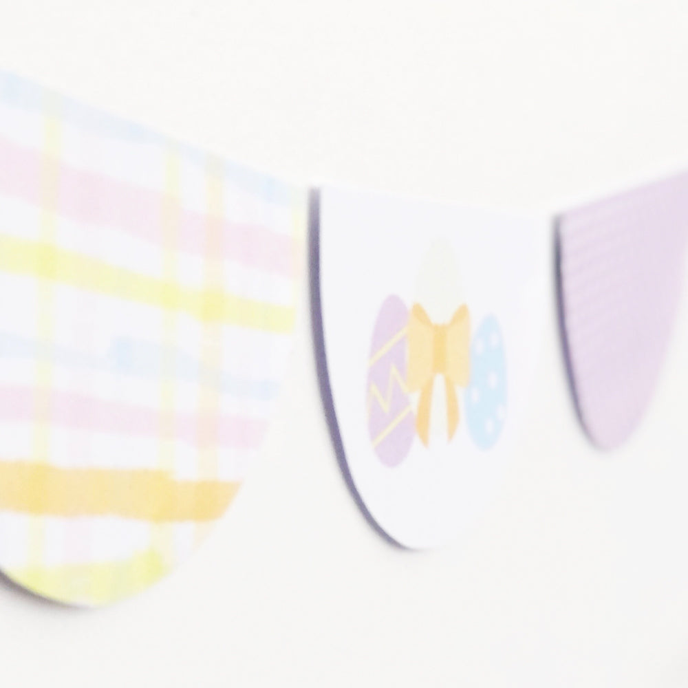 Scallop shaped Easter bunting in pastel colours.