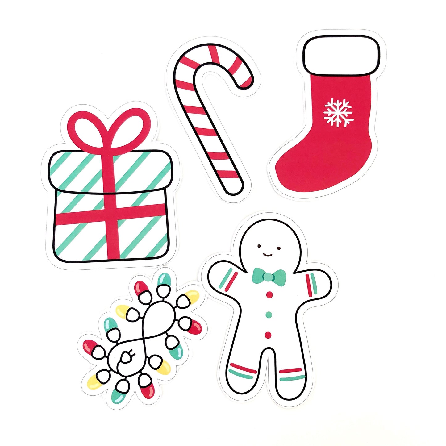 Bright red and green Christmas Cut out shapes displayed on white background.