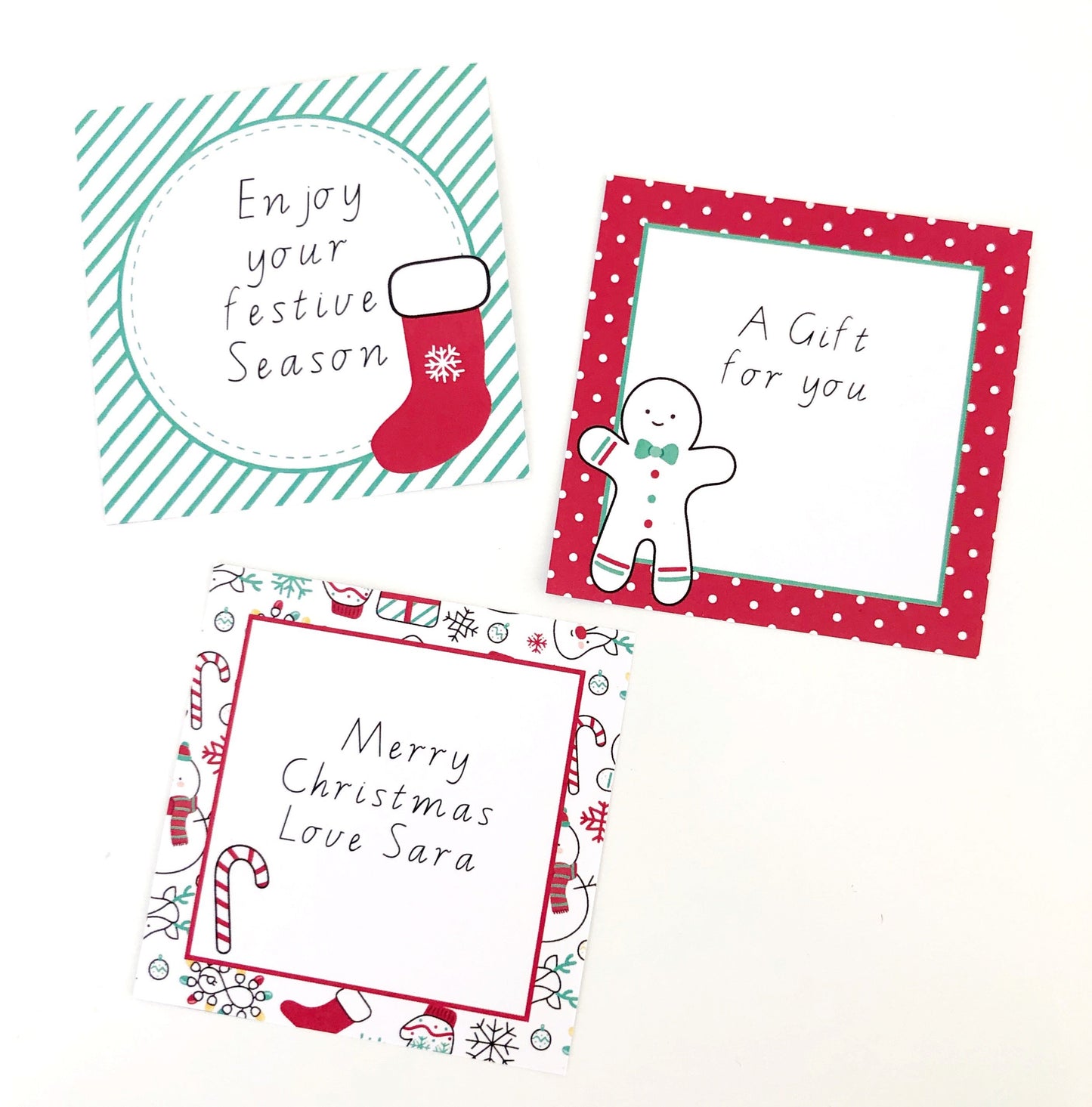 Editable square labels with placeholder words. The labels are bright red and green with Christmas graphics.