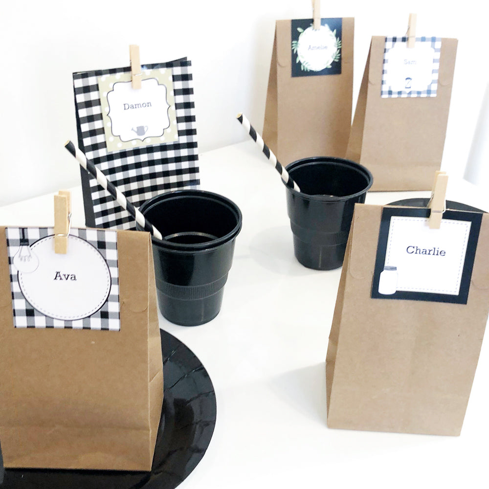 Brown party treat bags with black and white farmhouse square labels