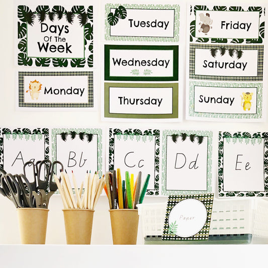 Close up image of safari themed classroom decor displayed on tubs and a white wall.