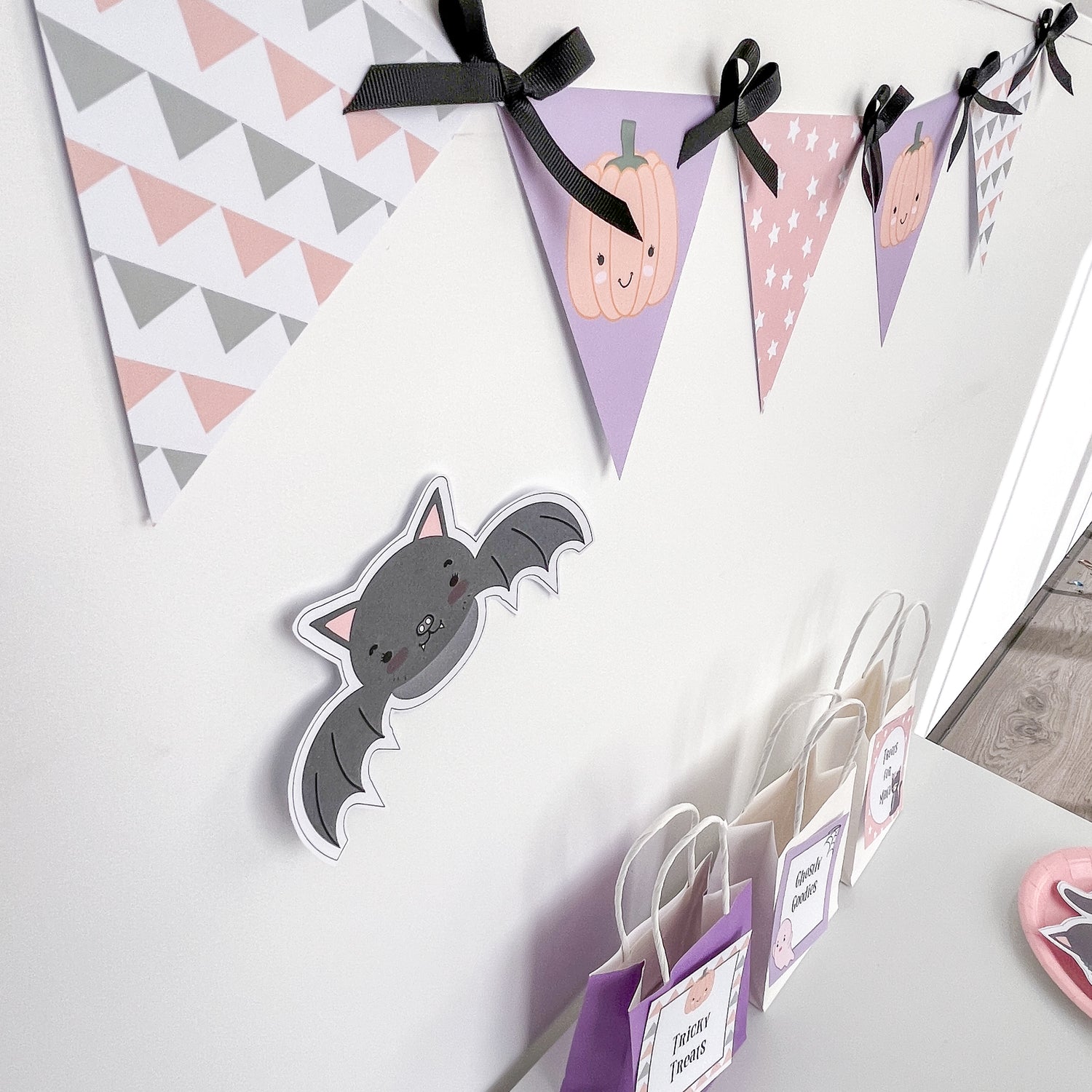 Halloween themed bunting in pastel colours with black ribbon
