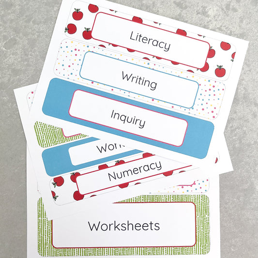 Teacher classroom labels with colourful borders on a grey surface