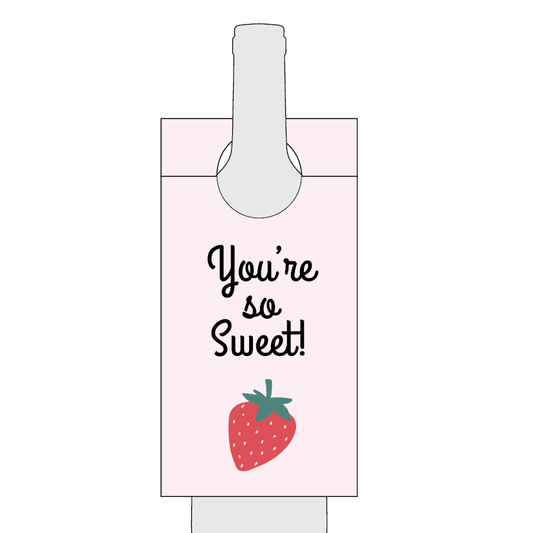 Bottle label with 'You're so sweet!' text and a strawberry illustration on a white background