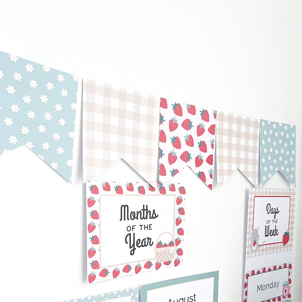 Set of educational posters with strawberry patterns on a white background. There is a bunting garland above them.