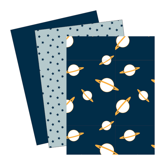 Three sheets of paper with space-themed patterns on a white background