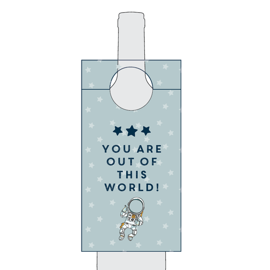 Gift bag with astronaut design and 'You are out of this world!' text on a light blue background.