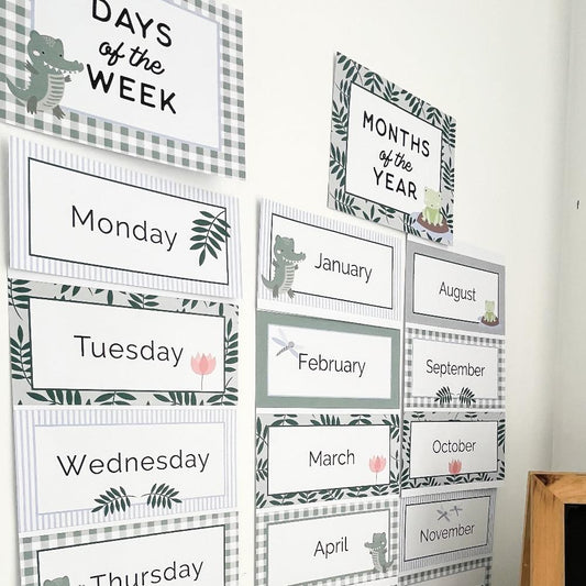 Days of the week and months of the year charts for a bulletin board in a classroom decorated in crocodile style theme.