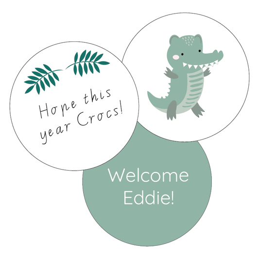Three circular stickers with a crocodile, leaves, and text on a white background
