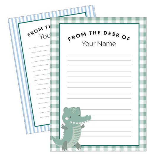Two sets of note paper with a crocodile design, one with stripes and one with a leafy pattern, both featuring a crocodile and the text 'From the desk of your name.'.