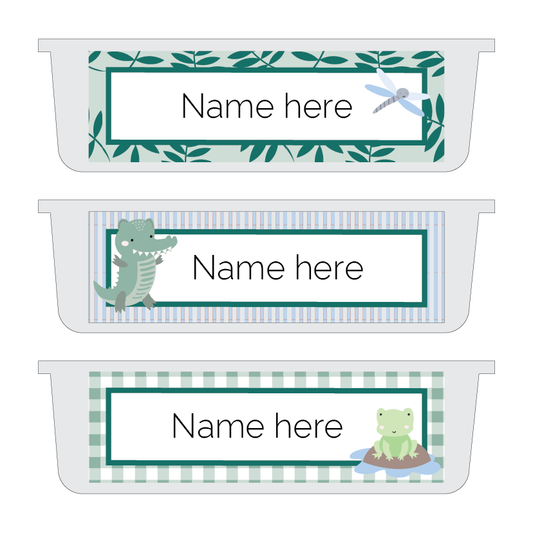 A set of printable name plates with a crocodile theme in a classroom setting. Each plate has a different design featuring a crocodile, a frog, a dragonfly, and a jungle leaf.