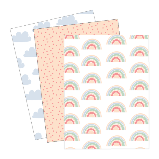 Three sheets of paper with different patterns: clouds, polka dots, and rainbows.