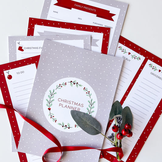 Printable Christmas planner with a red and white design, including cover page and various lists such as 'To Do' and 'Baking List'.