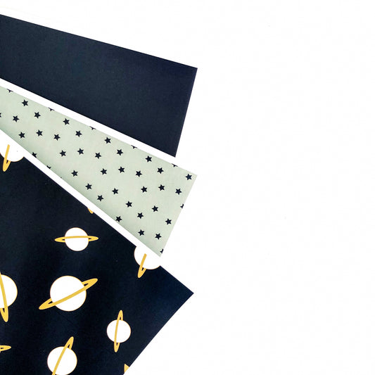 Space theme paper sheets spread on white background